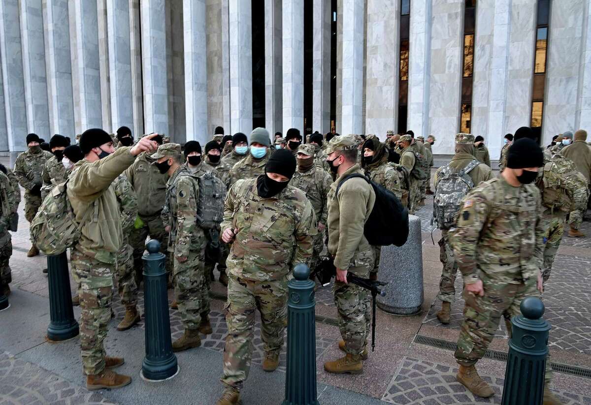 Scores of National Guard personnel finish their shift guarding the U.S. Capitol on Saturday, Jan. 9, 2021.