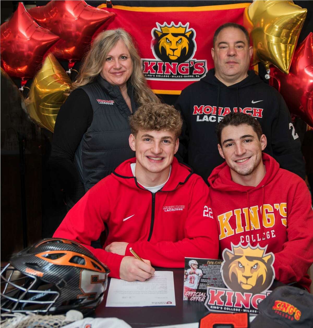 Evan Azary, surrounded my mom Jennifer, dad Joe and brother Alex, celebrates his choice to play soccer at King's College.