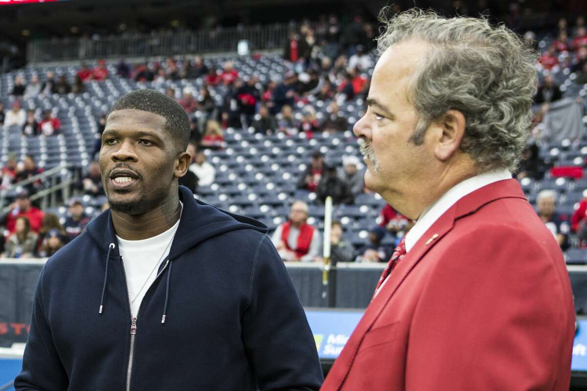It doesn't sound like Andre Johnson - shown here with Cal McNair before a game in 2016 - is going to change his mind about his criticism of the Texans and team executive Jack Easterby.