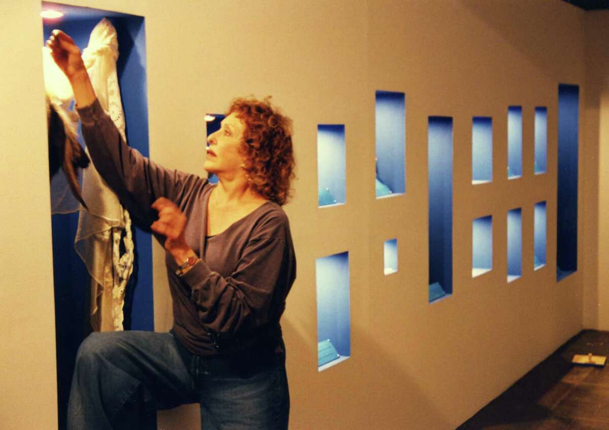 Carolee Schneemann works on her 1999 Artpace installation “Vesper’s Pool.”