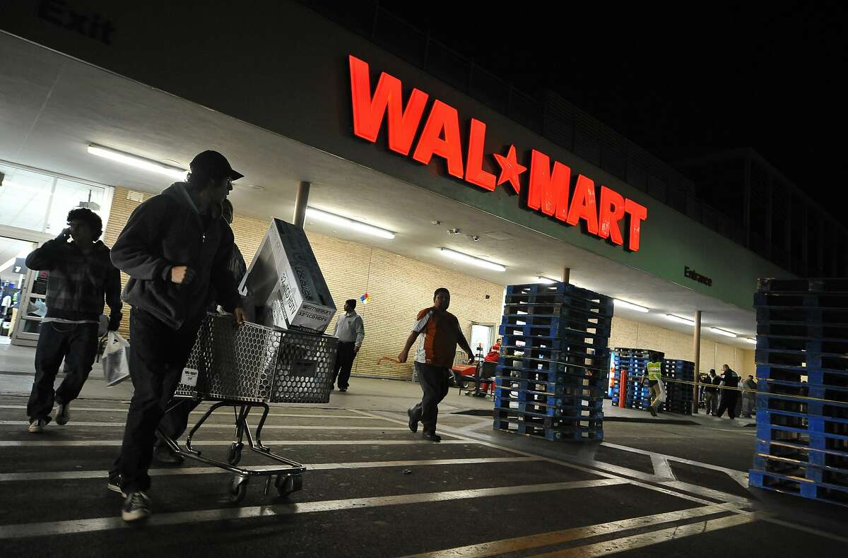 Shoppers wheel their purchases out of a Wal-Mart store in Los Angeles, California, before dawn on Black Friday, November 27, 2009. A major settlement with the company in 2010 over improper storage and handling of toxic waste helped the California District Attorney’s Association secure $210,000 to support future public-interest environmental litigation.