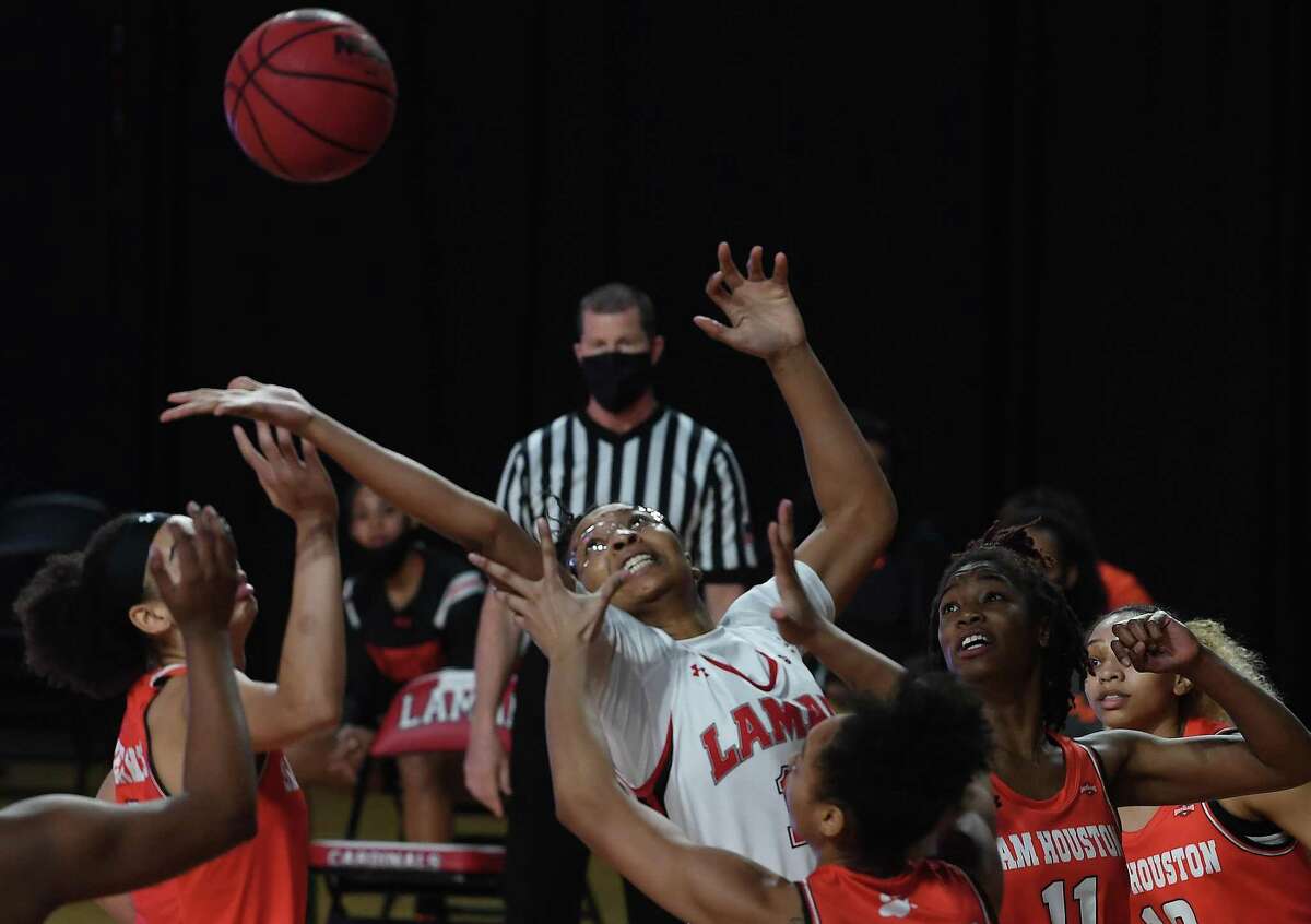 Lamar's Micaela Wilson battles for the rebound as they face Houston Baptist at home Wednesday. Photo taken Wednesday, January 13, 2021 Kim Brent/The Enterprise
