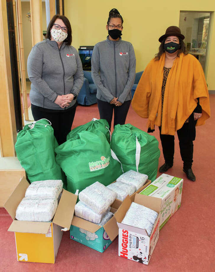 The Southern Illinois University Edwardsville Early Childhood Center donated 2,400 diapers to aid 17 families. Pictured from left are Rebecca Dabbs-MacLean, Lealia Williams and Norma McCandless, founder and executive director of the Metro East Diaper Bank.