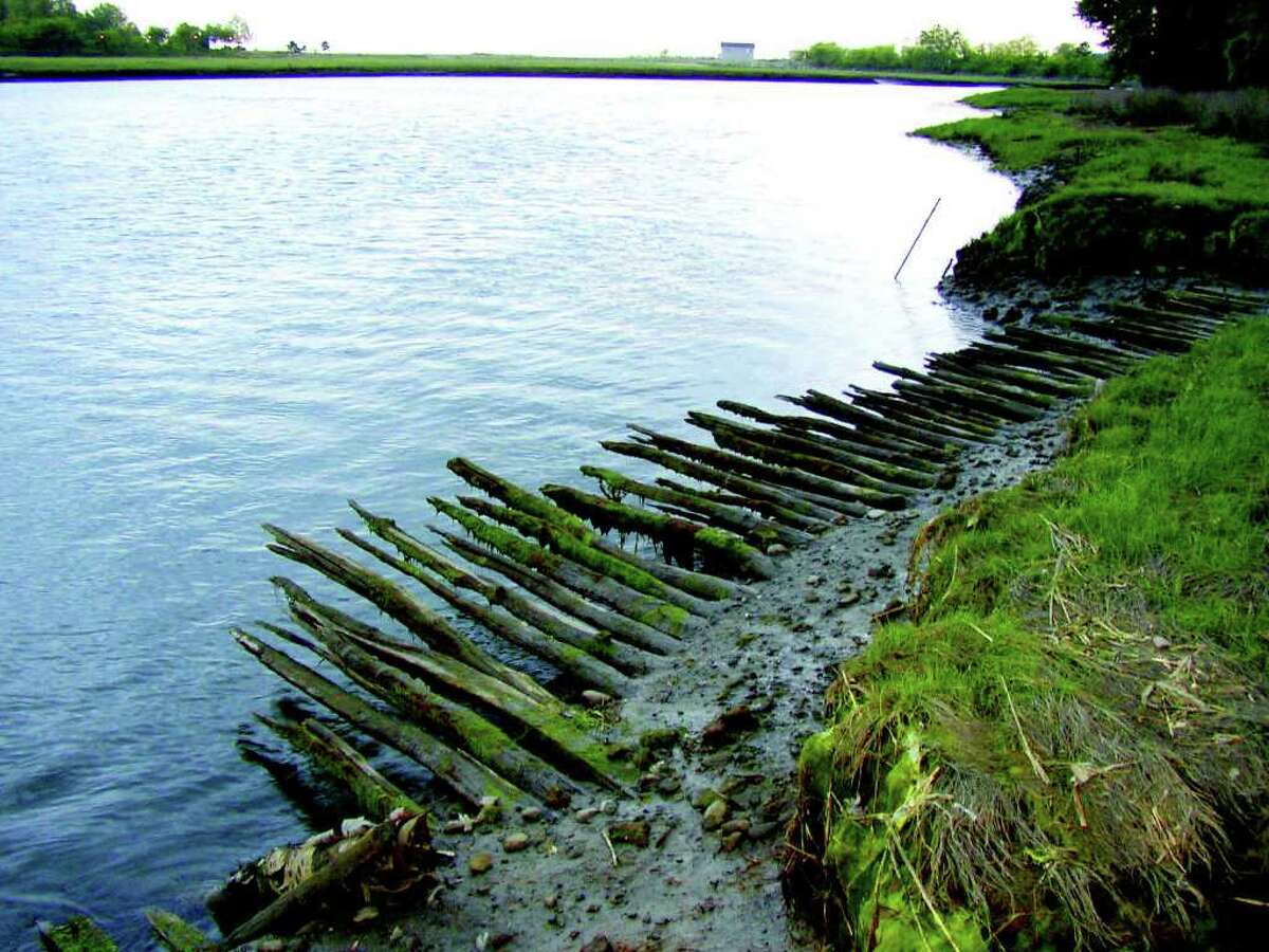 Historic Corduroy Road is shown along Ash Creek, next to Great Salt Marsh Island. The road has been designated a State Archaeological Preserve. The road derives its name from the rough ribbed wooden surface, which resembles corduroy fabric. It was constructed about 1750 and is one of only two such colonial roads known to exist in Connecticut.