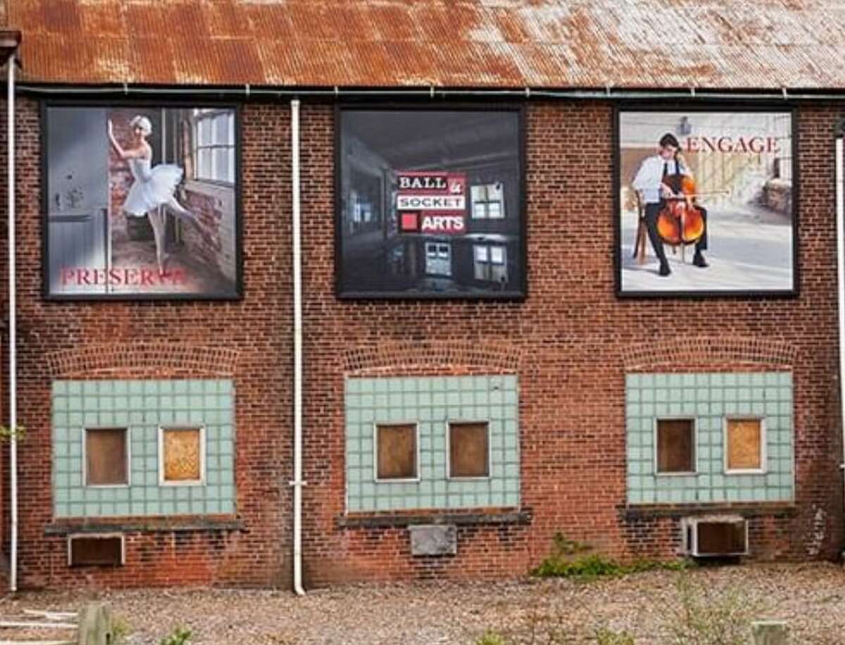 Artwork on the exterior of the former Ball & Socket manufacturing complex on West Main Street in Cheshire. A nonprofit is in the midst of turning the former factory complex into an arts center.