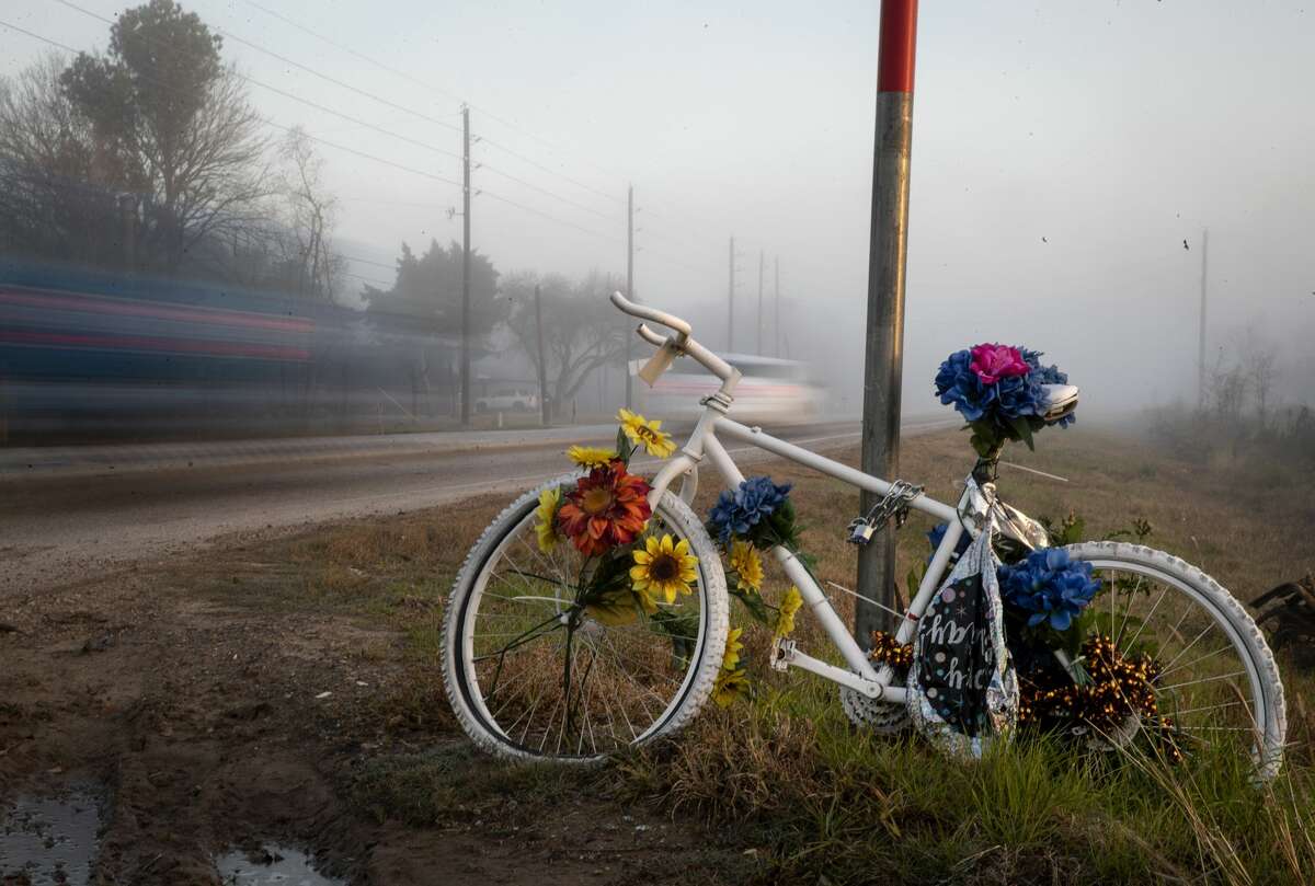 A ghost bike in memory of Henry Nikolai Benitez sits at the corner of FM 2218 and Koeblen Road on Thursday, Jan. 14, 2021, in Rosenberg.