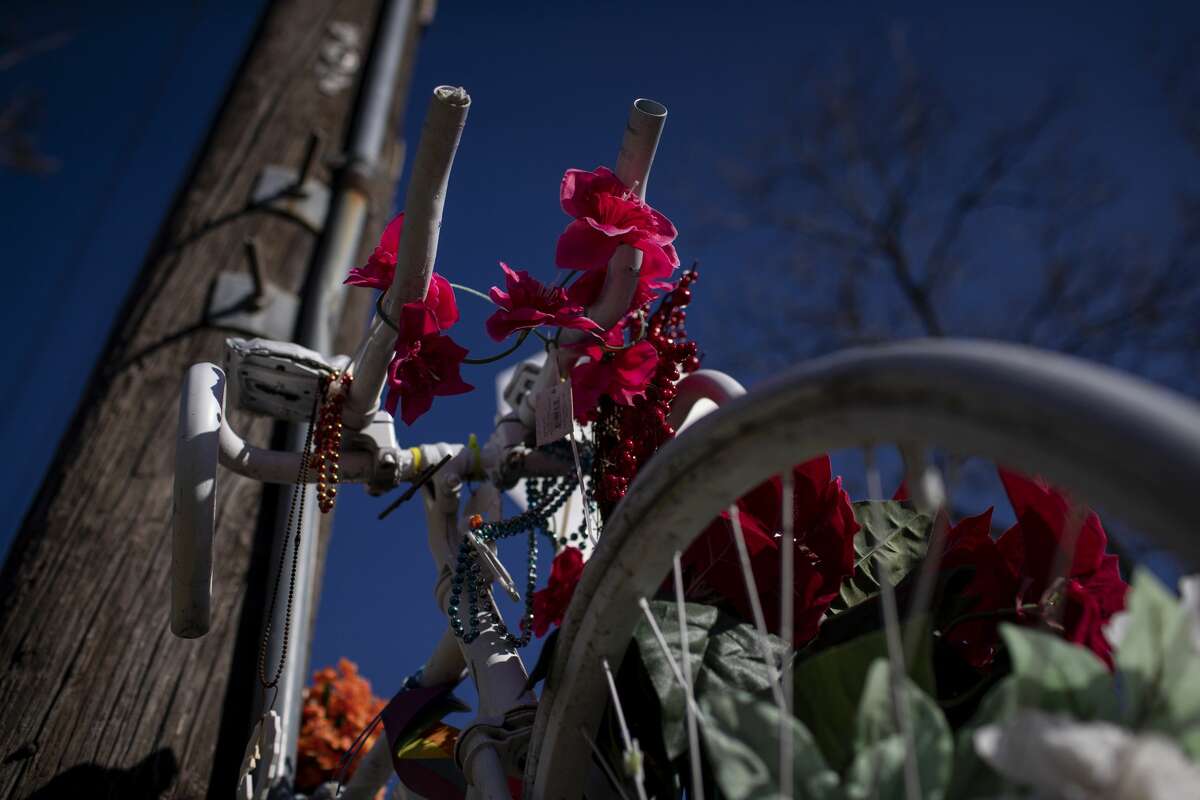 A ghost bike in memory of Mark Brooker sits at the corner of Oxford Street and East 38th Street on Thursday, Jan. 14, 2021, in Houston.