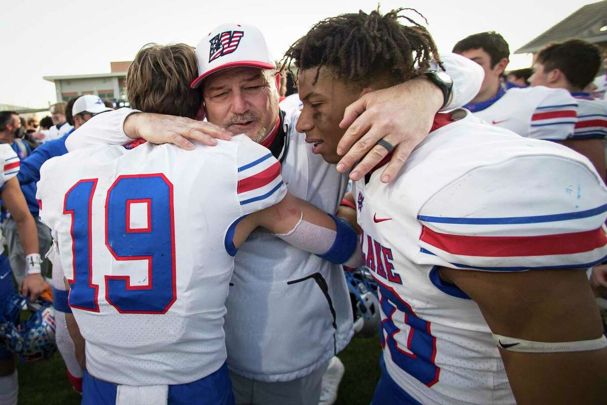 Austin Westlake head coach Todd Dodge embraces Luke Nicklos (19) and Zane Minors after Westlake beat North Shore 24-21 in the Class 6A Division I semifinal playoff high school football game at Legacy Stadium Saturday, Jan. 9, 2021 in Katy, Texas.