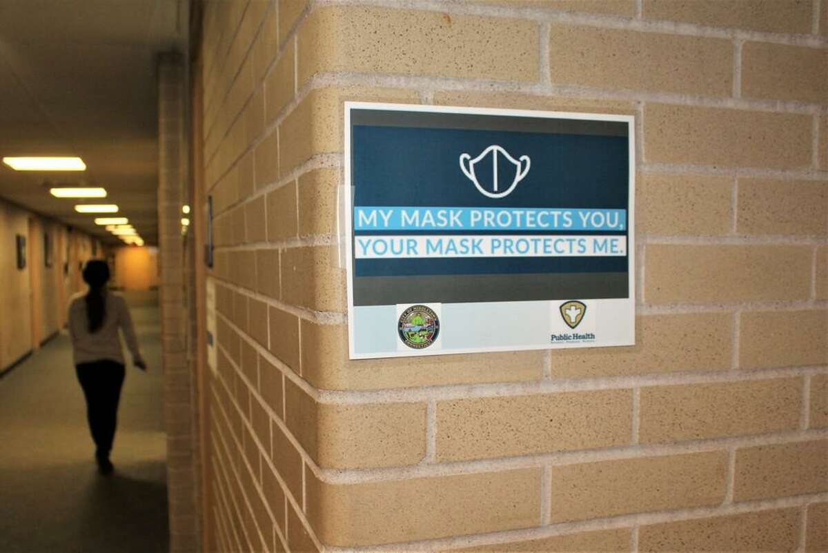 Signs warning Middletown City Hall personnel and visitors about the importance of mask wearing are posted throughout the 245 deKoven Drive building.
