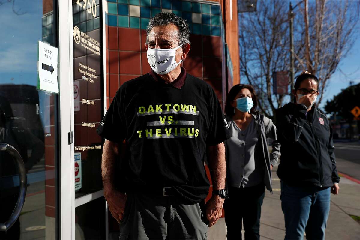 Oakland Councilman Noel Gallo waits in line to receive the Moderna COVID-19 vaccine shot at Native American Health Center in Oakland, Calif., on Thursday, January 14, 2021.