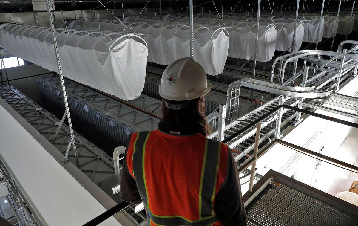 David Yeager, project manager for Vistra Zero, looks over the battery array in the old generator building at the Moss Landing Power Plant on Wednesday.