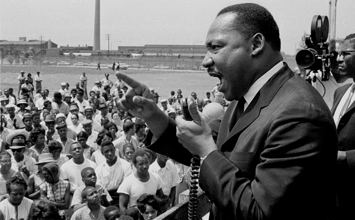 American Civil Rights leader Dr. Martin Luther King Jr. speaks at a rally held at the Robert Taylor Houses in Chicago, Illinois, 1960s.
