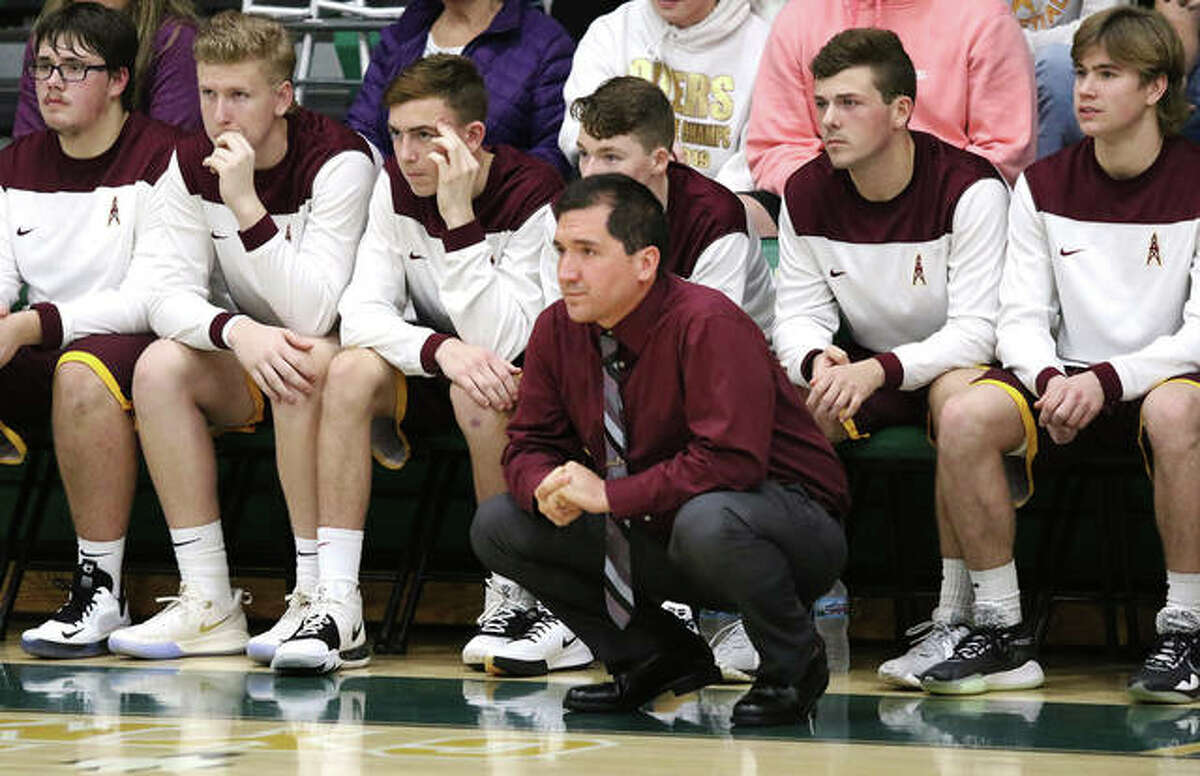 EA-WR boys basketball coach Steve Flowers watches from in front of his team’s bench. EA-WR athletic director Mark Beatty said that guidelines and recommendations issued by the IHSA last fall would make playing safer than Illinois-based athletes playing in club tournaments in other states.