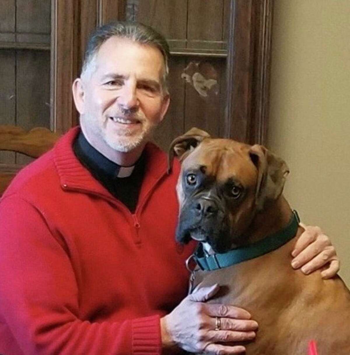 The Rev. John Antonelle, pastor of St. Mary Church in Portland with his — and the parish’s — dog, Patsy.