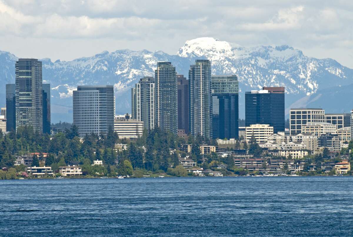 City of Bellevue, Wash. with Lake Washington in the foreground and the Cascade Mountains behind