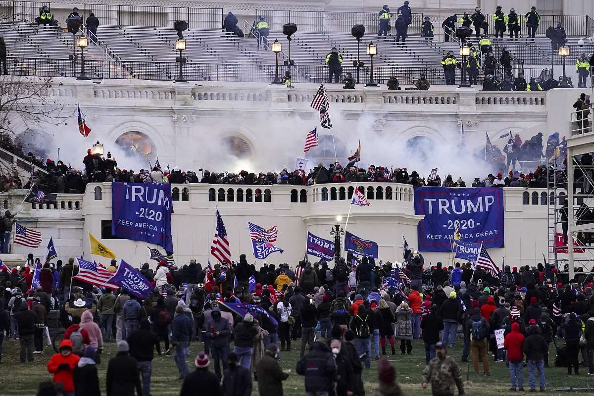 FILE - In this Wednesday, Jan. 6, 2021, file photo, violent protesters, loyal to President Donald Trump, storm the Capitol, in Washington. (AP Photo/John Minchillo, File)