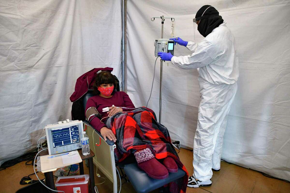 Rosalinda Espinoza, 58, receives an infusion of antibodies to battle COVID-19 at the Freeman Coliseum complex on Friday, Jan. 15, 2021. The infusion center is one way to avoid sending more patients to hospitals, which are close to being overloaded because of the coronavirus pandemic.