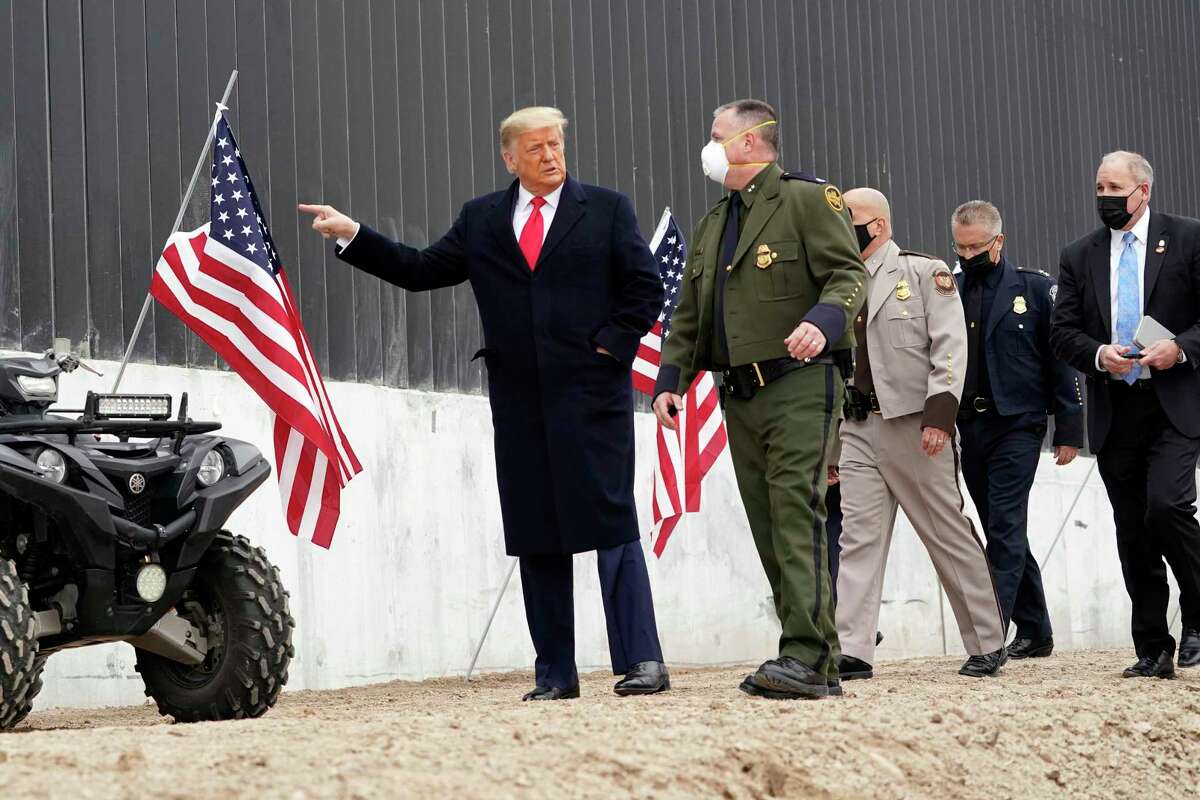 President Donald Trump tours a section of the U.S.-Mexico border wall under construction Tuesday, Jan. 12, 2021, in Alamo, Texas.