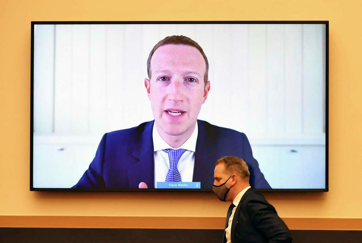 In this July 29, 2020 file photo, Facebook CEO Mark Zuckerberg testifies remotely during a House Judiciary subcommittee hearing on Capitol Hill. Facebook’s efforts to crack down on extremists in the wake of the deadly Jan. 6th insurrection at the U.S. Capitol have elicited pushback from conservatives who are accusing this and other Big Tech companies of “censorship.” (Mandel Ngan/Pool via AP)