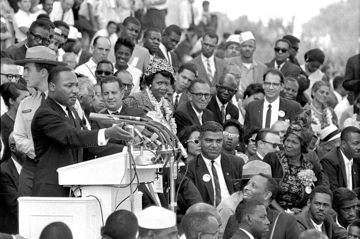 In this Aug. 28, 1963 file photo, the Rev. Dr. Martin Luther King Jr., head of the Southern Christian Leadership Conference, speaks to thousands during his "I Have a Dream" speech in front of the Lincoln Memorial for the March on Washington for Jobs and Freedom in Washington. Actor-singer Sammy Davis Jr. is at bottom right. It has been cited as one of America's essential ideals, its language suggestive of a constitutional amendment on equality: People should "not be judged but he color of their skin but by the content of their character."