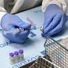 Student pharmacist Wilbur Quimba dilutes vials of the Pfizer-BioNTech COVID-19 vaccine at University Medical Center of Southern Nevada on Dec. 16, 2020, in Las Vegas, Nevada. (Ethan Miller/Getty Images/TNS)