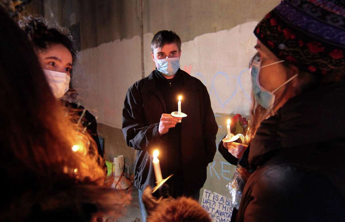 Jared Sullivan attends a vigil held in memory of his friend Mubarak Soulemane at the I95 overpass along Campbell Avenue in West Haven, Conn., on Friday Jan. 15, 2021. Soulemane, a New Haven resident, was fatally shot by state Trooper Brian North after a car chase on Jan. 15, 2020.