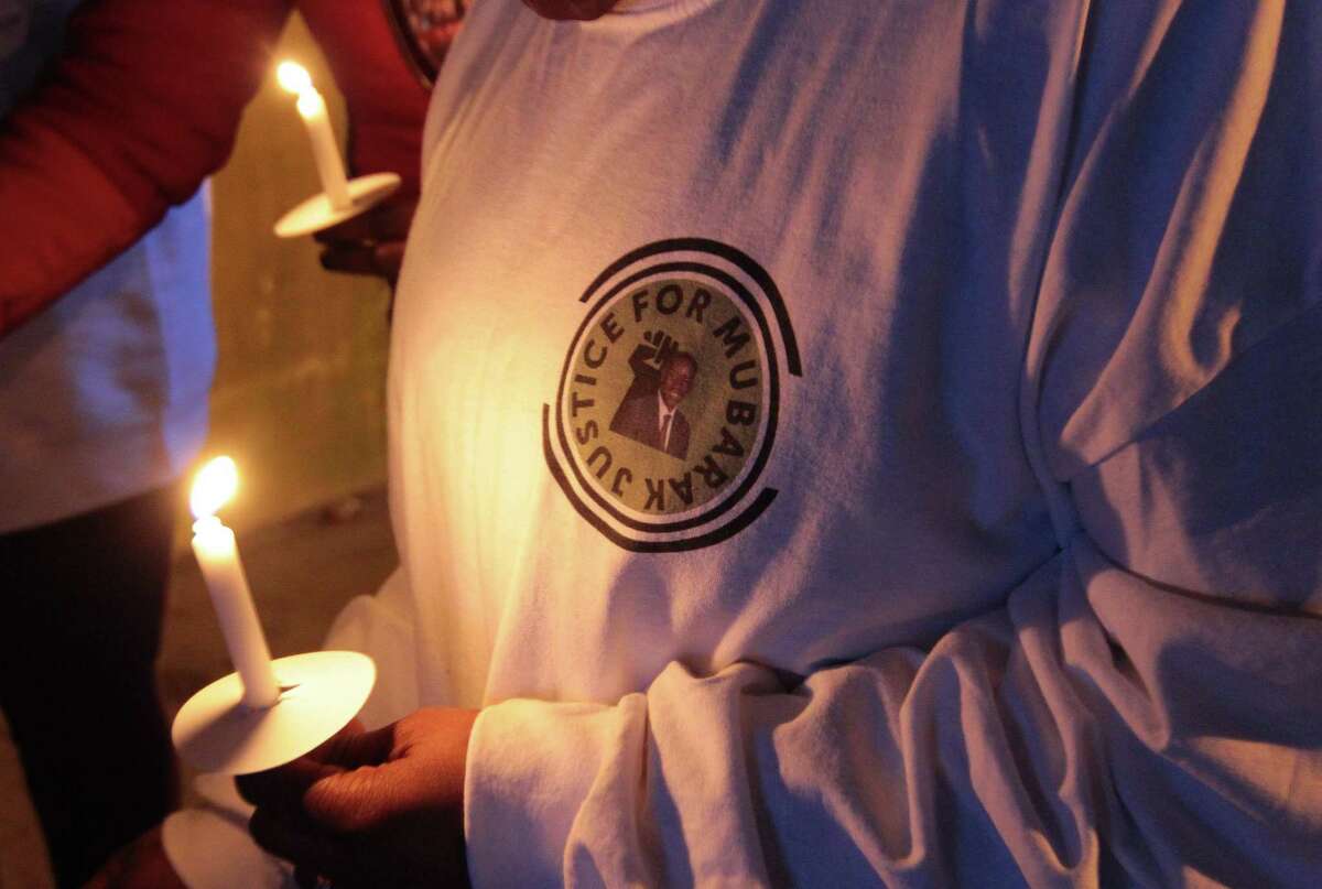 A vigil is held in memory of Mubarak Soulemane at the I95 overpass along Campbell Avenue in West Haven, Conn., on Friday Jan. 15, 2021. Soulemane, a New Haven resident, was fatally shot by state Trooper Brian North after a car chase on Jan. 15, 2020.