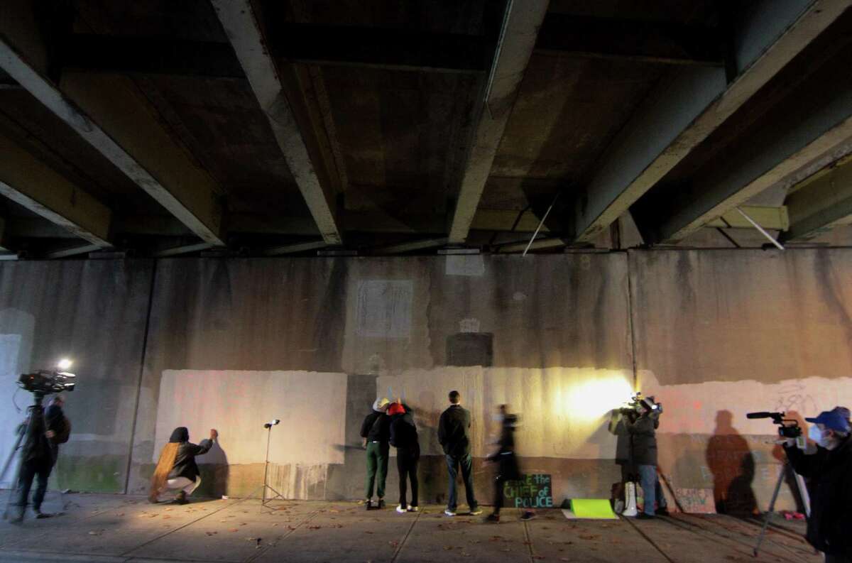 A vigil is held in memory of Mubarak Soulemane at the I95 overpass along Campbell Avenue in West Haven, Conn., on Friday Jan. 15, 2021. Soulemane, a New Haven resident, was fatally shot by state Trooper Brian North after a car chase on Jan. 15, 2020.