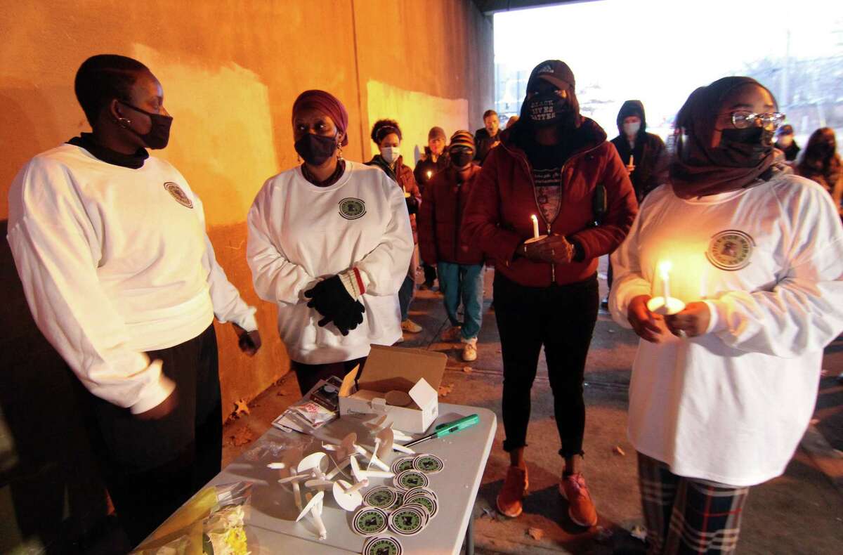 A vigil is held in memory of Mubarak Soulemane at the I95 overpass along Campbell Avenue in West Haven, Conn., on Friday Jan. 15, 2021. Soulemane, a New Haven resident, was fatally shot by state Trooper Brian North after a car chase on Jan. 15, 2020.