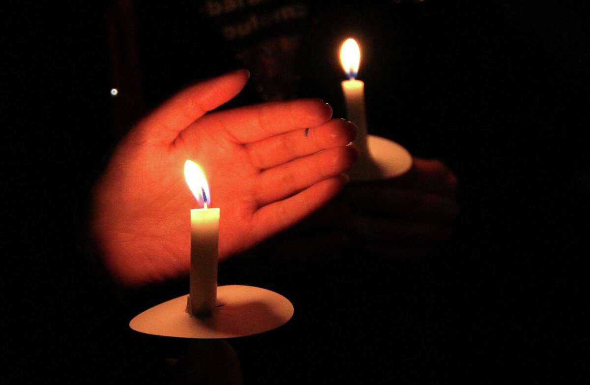 A vigil is held in memory of Mubarak Soulemane at the I95 overpass along Campbell Avenue in West Haven, Conn., on Friday Jan. 15, 2021. Soulemane, a New Haven resident, was fatally shot by state Trooper Brian North after a car chase on Jan. 15, 2020.