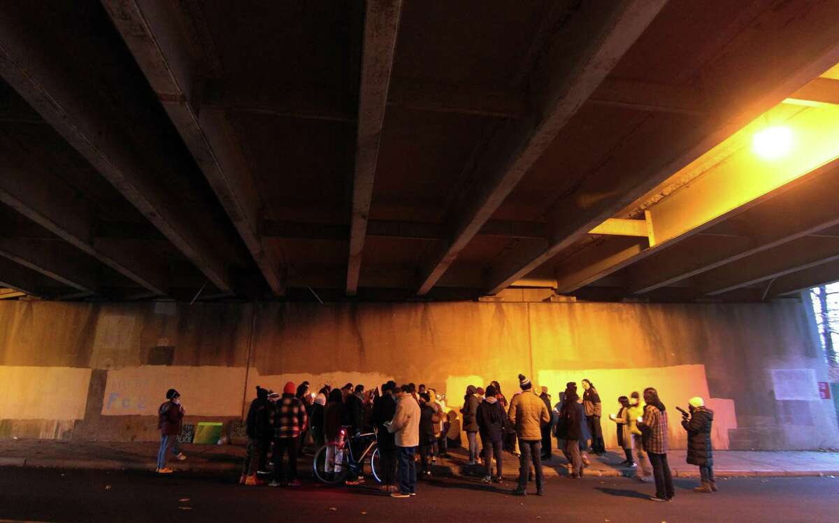 A vigil is held in memory of Mubarak Soulemane at the I95 overpass along Campbell Avenue in West Haven, Conn., on Friday Jan. 15, 2021. Soulemane, a New Haven resident, was fatally shot by state Trooper Brian North after a car chase on Jan. 15, 2020.
