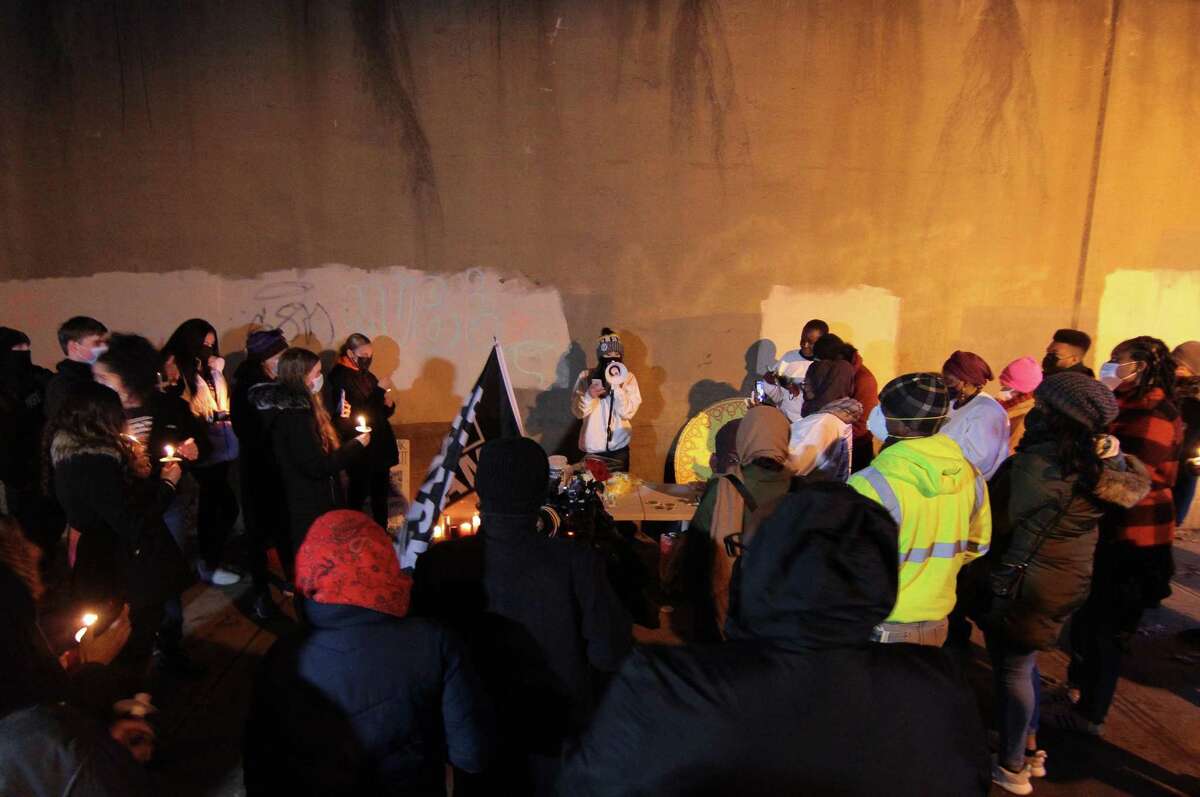 A vigil is held in memory of Mubarak Soulemane at the I95 overpass along Campbell Avenue in West Haven, Conn., on Friday Jan. 15, 2021. Soulemane, a New Haven resident, was fatally shot by state Trooper Brian North after a car chase on Jan. 15, 2020.
