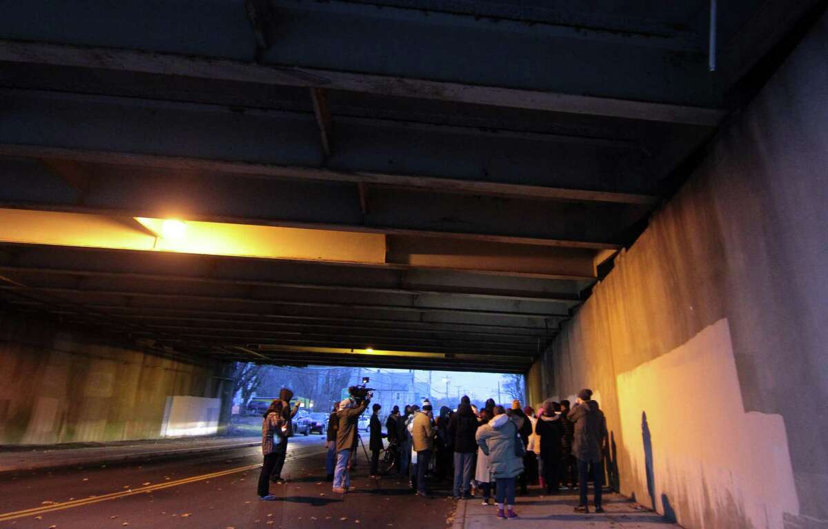 A vigil is held in memory of Mubarak Soulemane at the I95 overpass along Campbell Avenue in West Haven, Conn., on Friday Jan. 15, 2021. Soulemane, a New Haven resident, was fatally shot by state Trooper Brian North after a car chase on Jan. 15, 2020.