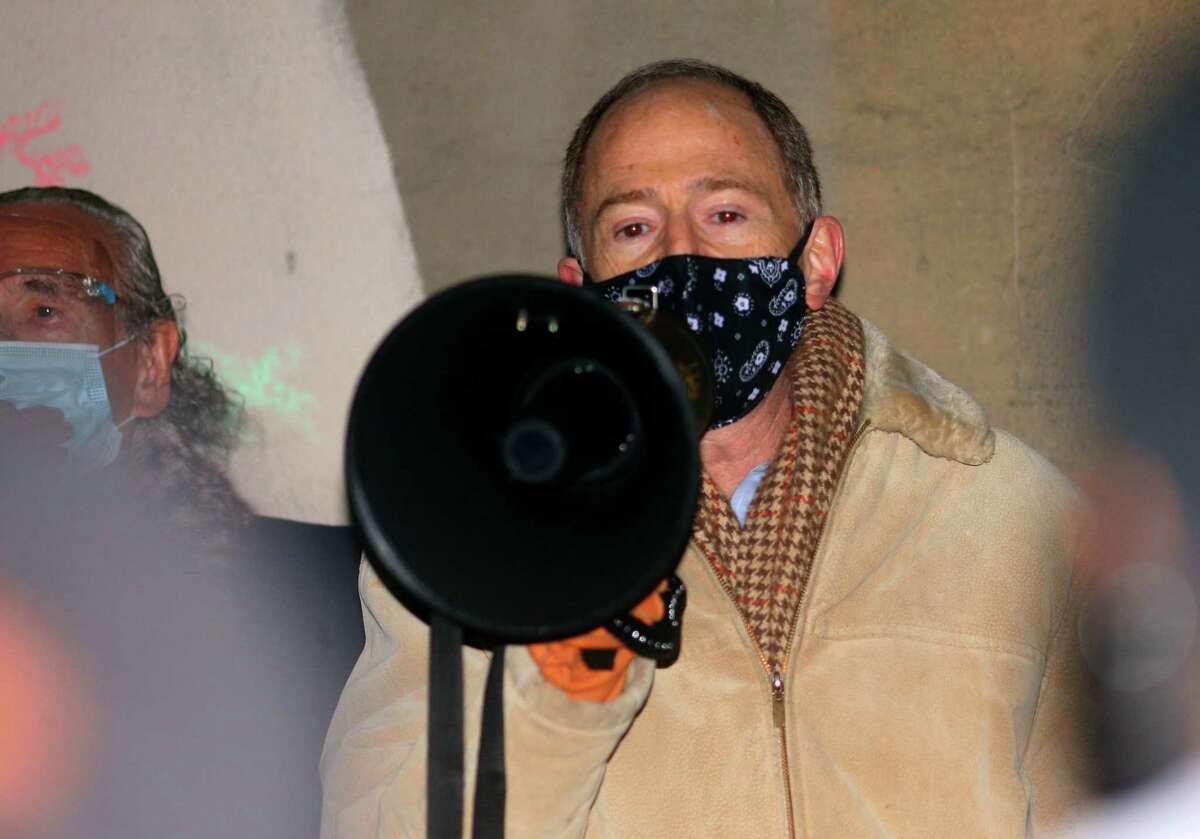 Family lawyer Mark Arons speaks during a vigil held in memory of Mubarak Soulemane at the I95 overpass along Campbell Avenue in West Haven, Conn., on Friday Jan. 15, 2021. Soulemane, a New Haven resident, was fatally shot by state Trooper Brian North after a car chase on Jan. 15, 2020.
