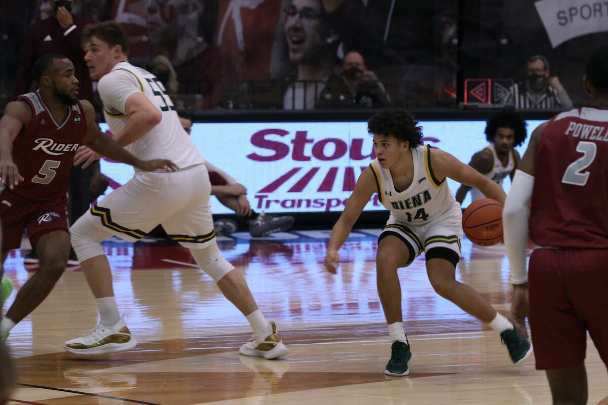 Jordan King of Siena looks for room to dribble against Rider on Saturday. He had a career-high 22 points in the game.