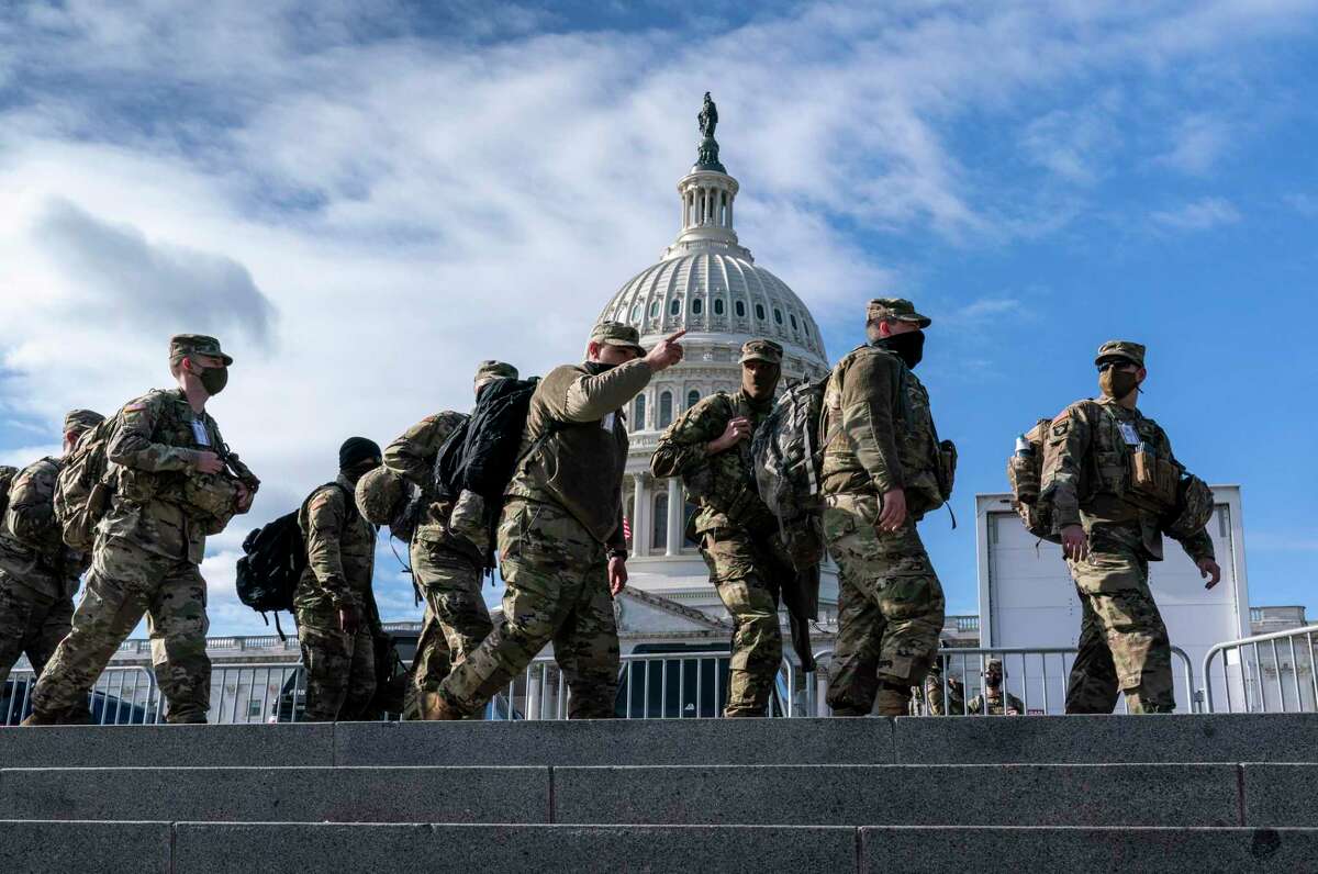 National Guard troops reinforce security around the U.S. Capitol ahead of the inauguration of President-elect Joe Biden and Vice President-elect Kamala Harris, Sunday, Jan. 17, 2021, in Washington. (AP Photo/J. Scott Applewhite)