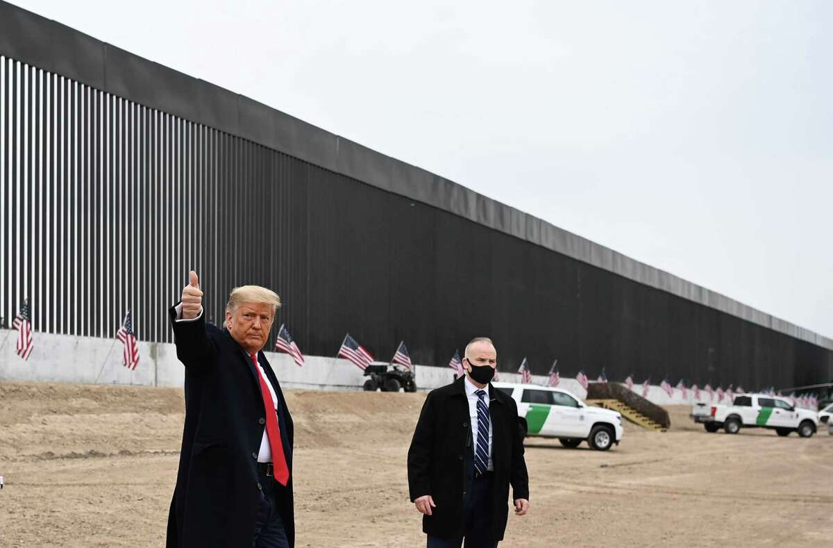 President Donald Trump gives a thumbs up after touring a section of the border wall in Alamo, Texas on Jan. 12, 2021.