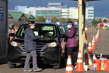 Community Health Center Inc. opened the state's first and largest large-scale outdoor COVID-19 vaccination clinic Sunday, Jan. 17, 2021 on a runway at the long retired Pratt & Whitney airport at Rentschler Field in East Hartford.