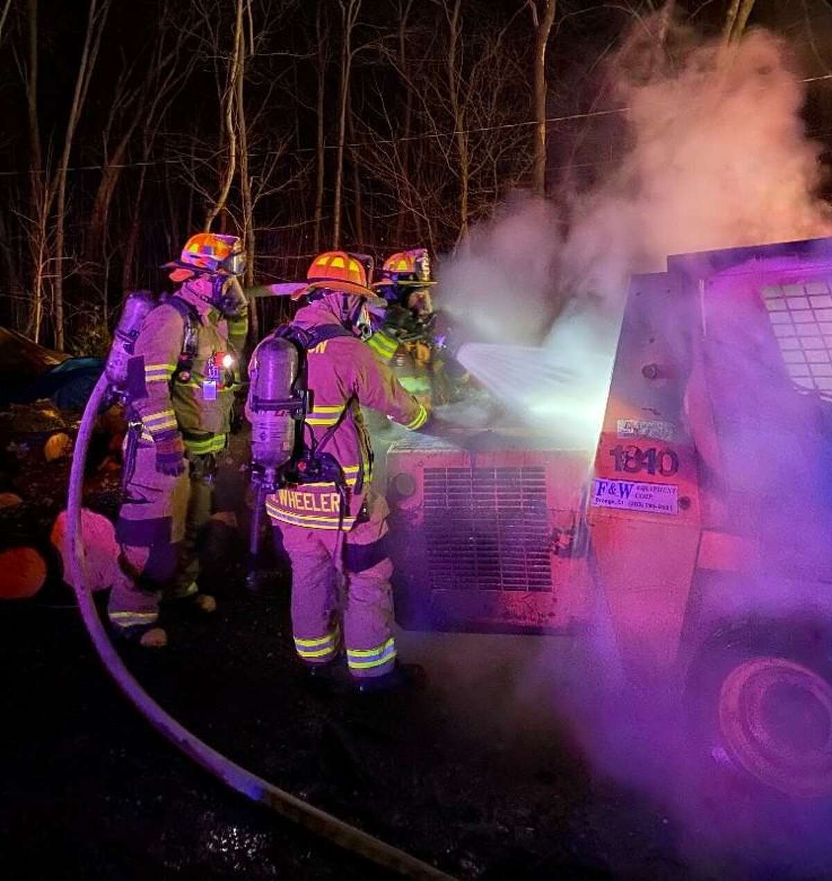 Shelton firefighters Fire battle an excavator fire Saturday, Jan. 16, at a property on East Village Road.