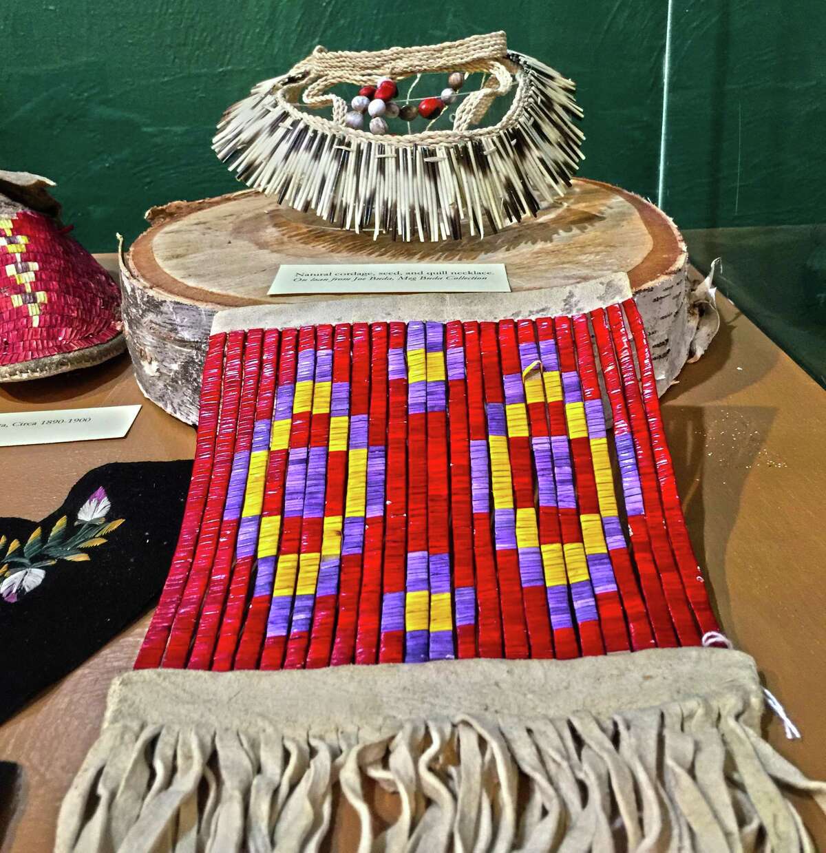 Examples of exhibits, including a bag made with porcupine quills, on display at the Institute of American Indian Studies.