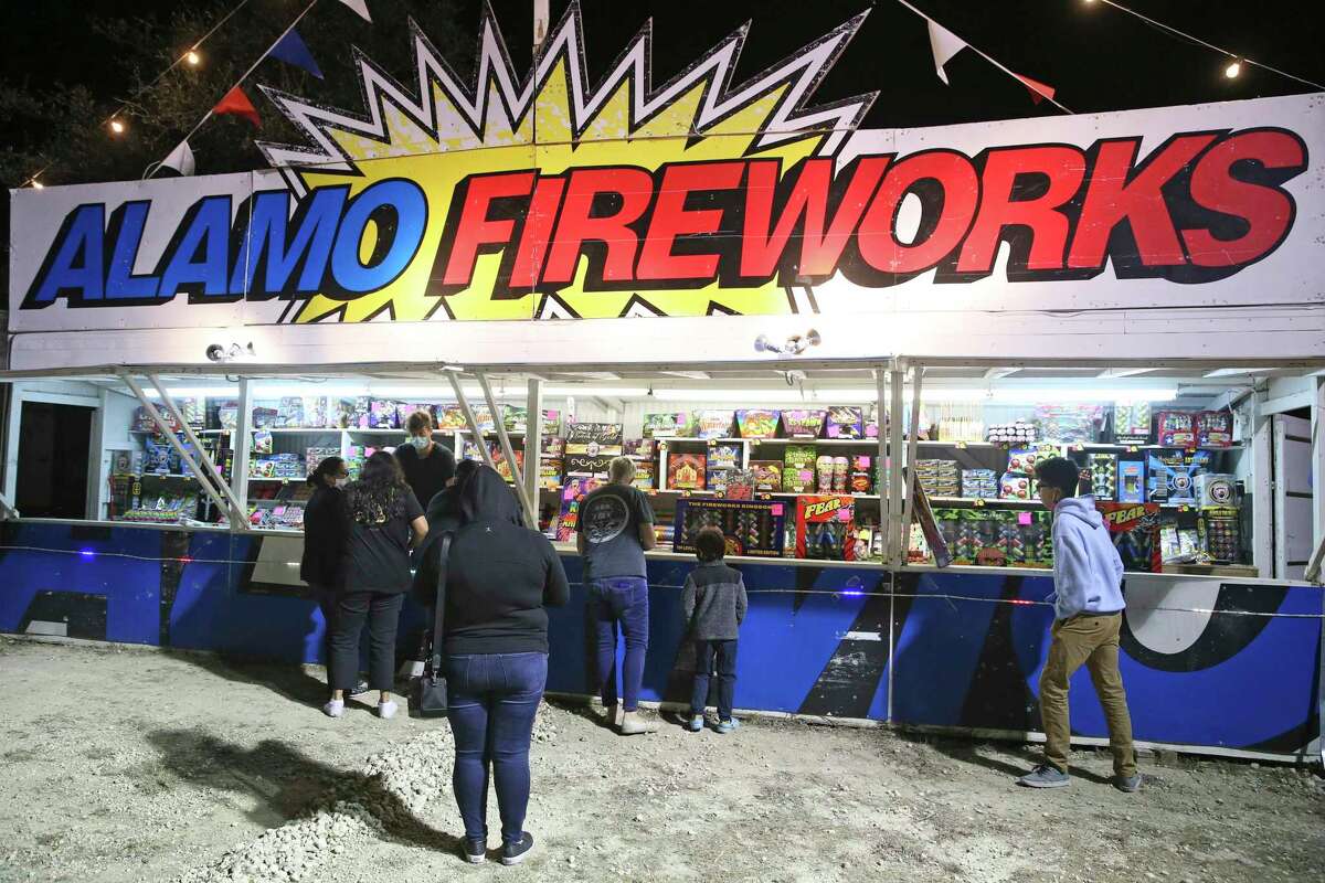 Nehemiah Nulton sells fireworks to groups of people arriving at his Alamo Fireworks stand on East Borgfeld Road on Dec. 28. A citywide celebration on New Year’s Eve led to only one citation and 21 warning for fireworks use.