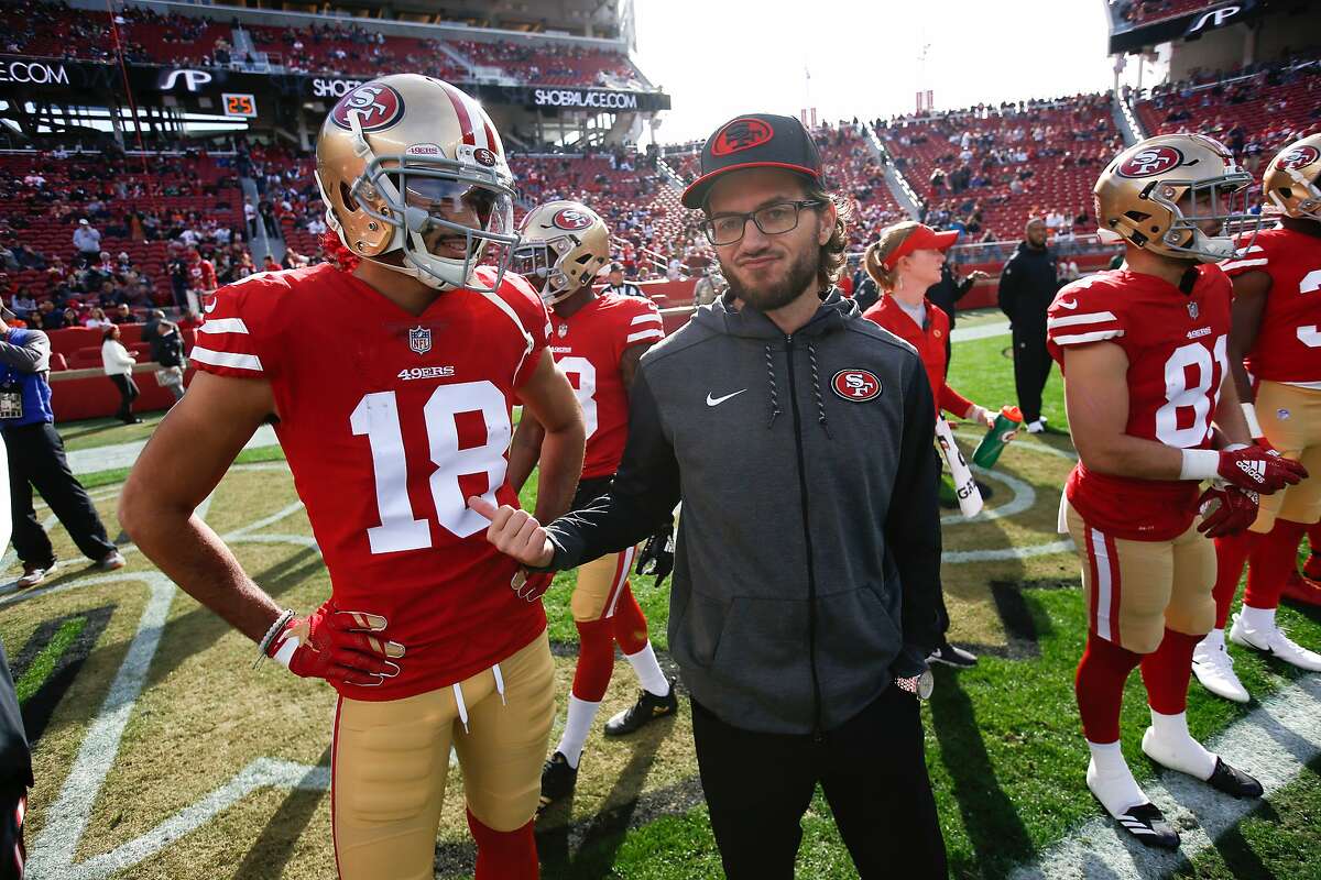 Run game coordinator Mike McDaniel talks with former 49ers wide receiver Dante Pettis before a 2018 game against Chicago.