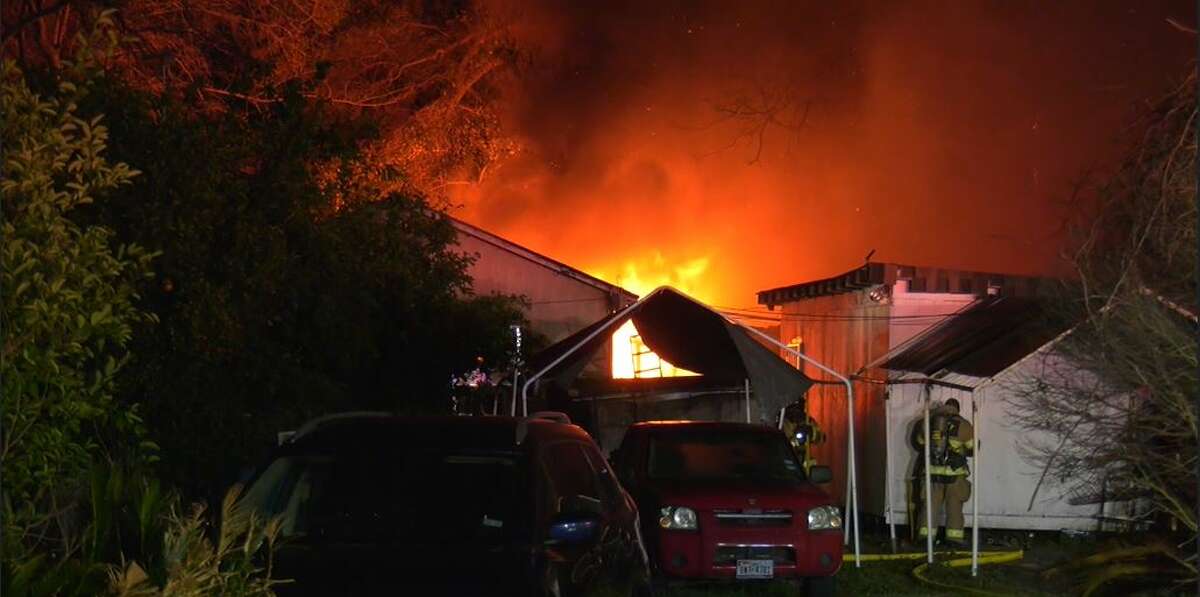 Four residential structures were destroyed and three others burned when a fire broke out for unknown reasons late Monday in a northeast Harris County neighborhood that is not equipped with fire hydrants.