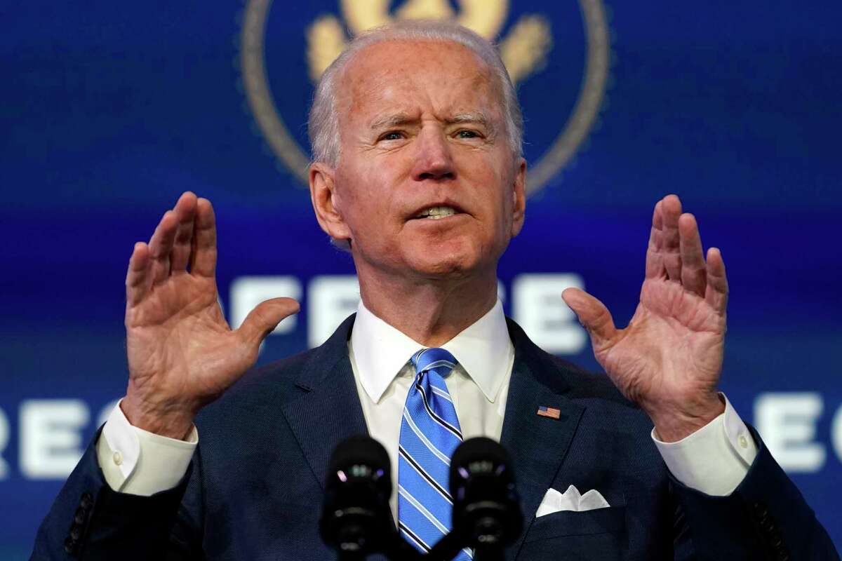 In this Jan. 14, 2021 photo, President-elect Joe Biden speaks during an event at The Queen theater, in Wilmington, Del.