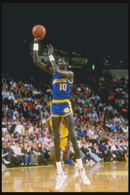 1988-1989: Manute Bol of the Golden State Warriors shoots the basketball. Mandatory Credit: Tim de Frisco /Allsport