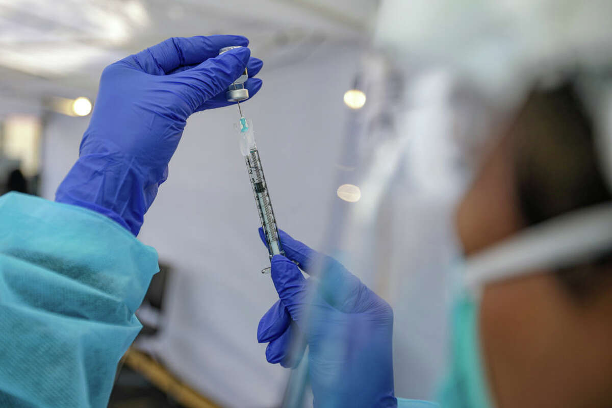 A nurse Cherry Costales prepares the Pfizer-BioNTech COVID-19 vaccine at St. John's Well Child & Family Center on Thursday, January 7, 2021 in Los Angeles, California.