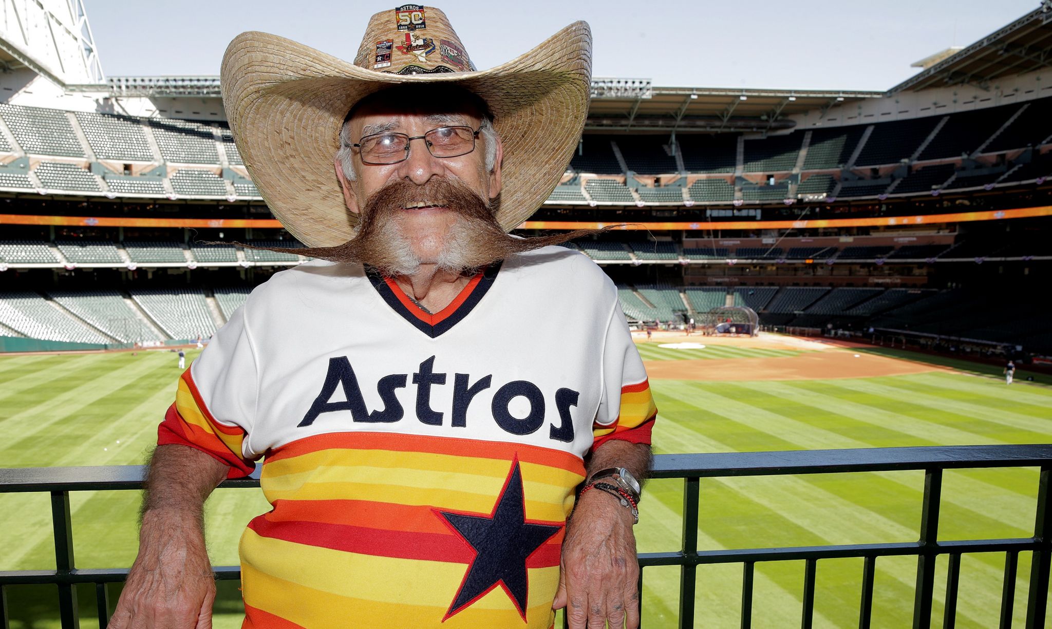 This Astros fan's mustache is at least three times as wide as his face