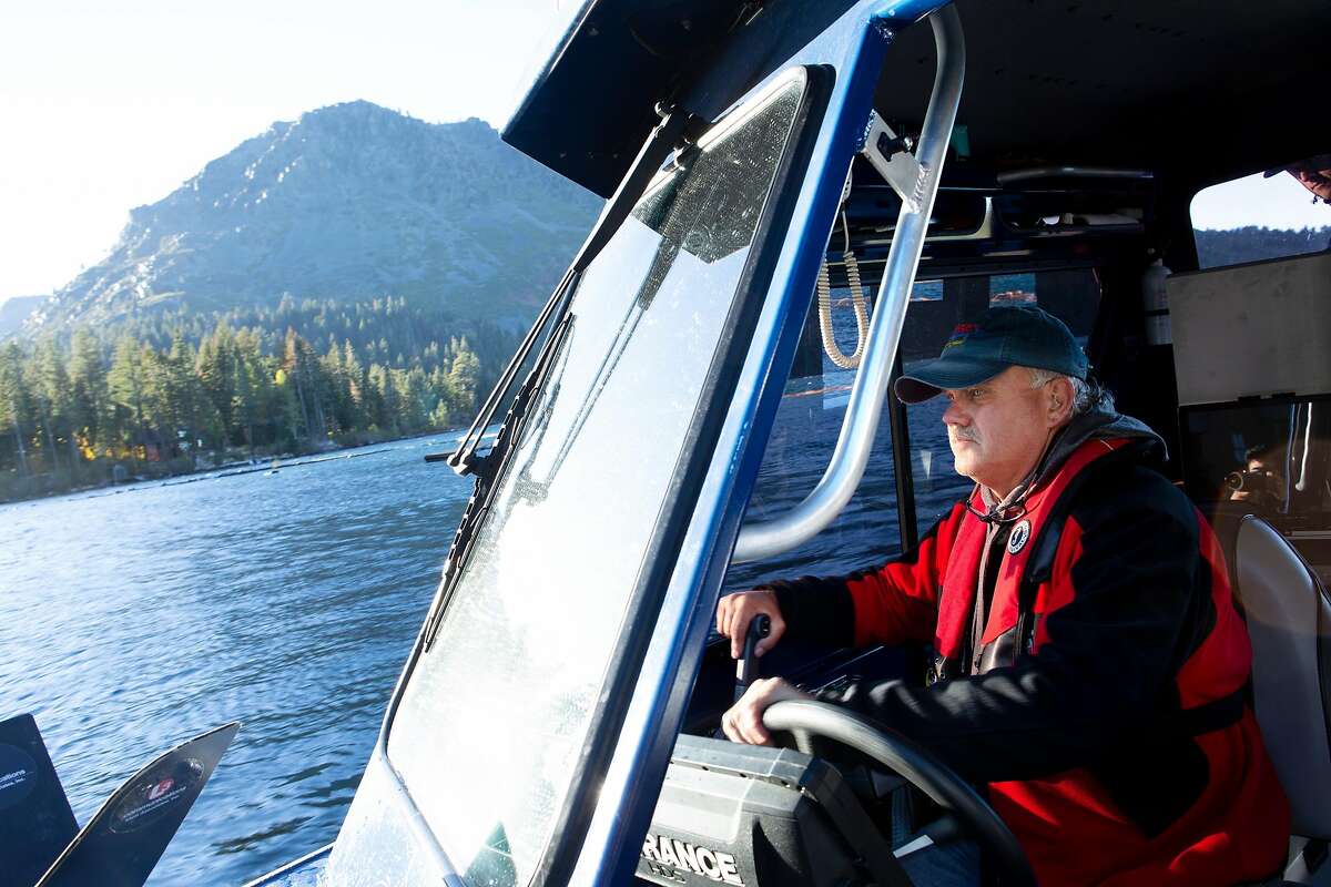 Keith Cormican of Bruce's Legacy steers back to shore after searching Fallen Leaf Lake for David Ward on Sunday, Oct. 14, 2018, in South Lake Tahoe, Calif. Bruce's Legacy is a search and recovery team for drowned victims. They attempted to locate David Ward, who drowned in the lake in a 1996 boating accident at the age of 21.