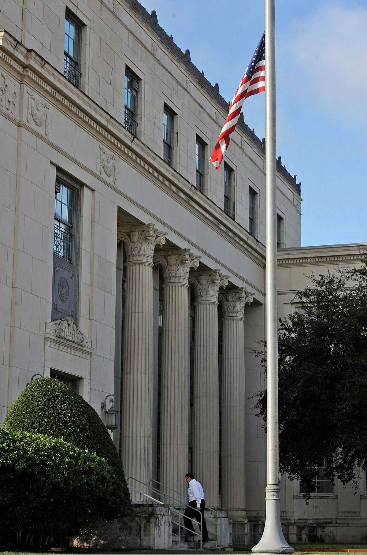 In the wake of former Congressman Jack Brook's death, the flags at the Jack Brooks Federal Courthouse are flown at half staff. The long term congressman passed away Tuesday night from a sudden illness. Photo taken Wednesday, December 05, 2012 Guiseppe Barranco/The Enterprise