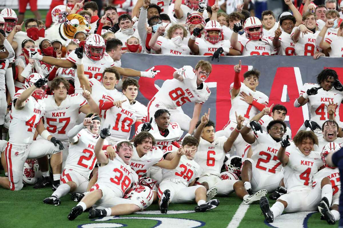 The Katy football team celebrates their 51-14 win over Cedar Hill to capture the Class 6A Division II UIL State Championship at AT&T Stadium on Saturday in Arlington.